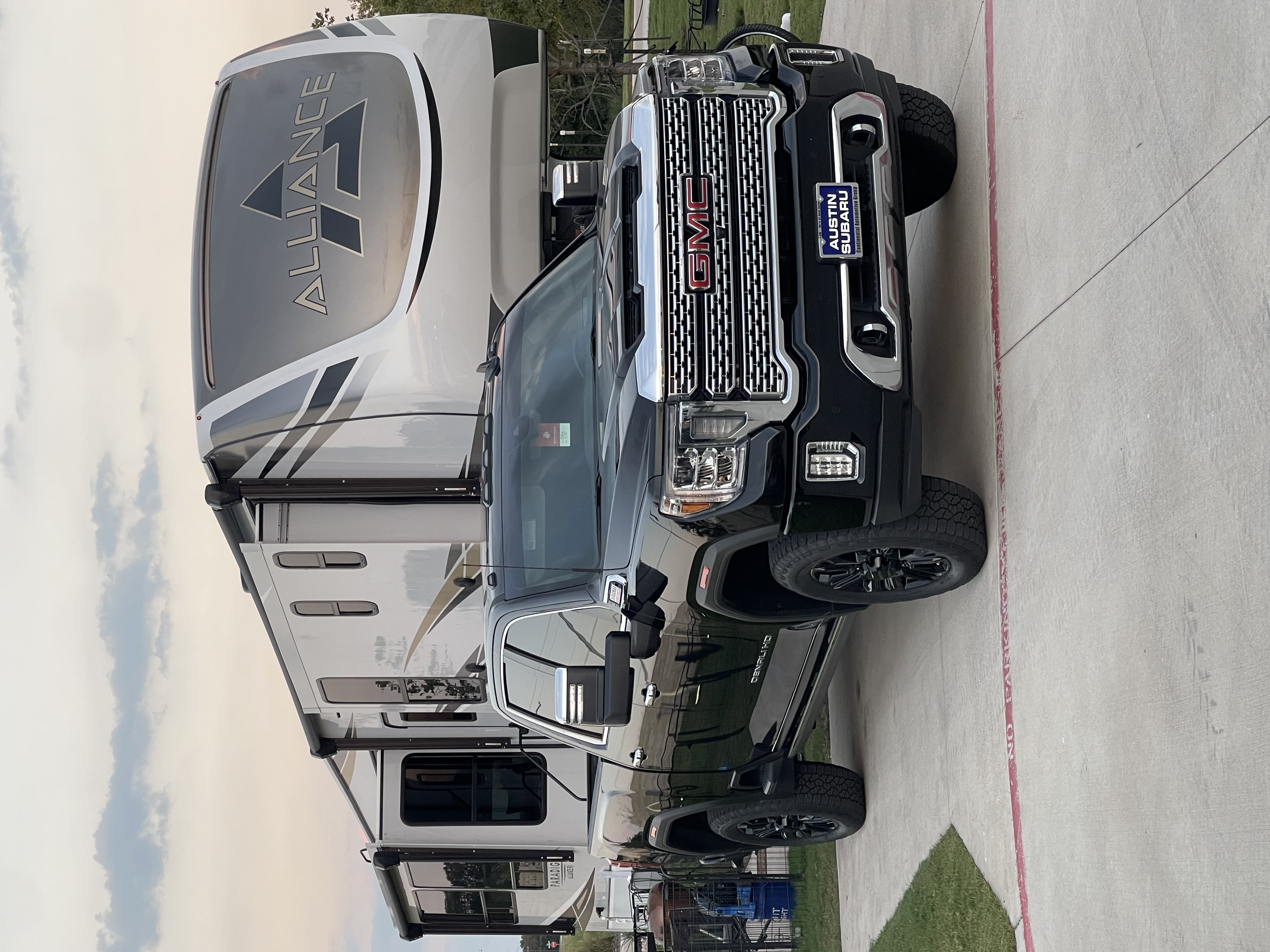 Alliance Paradigm fifth-wheel RV parked alongside a Boss Bull Mobile RV Services truck — on-site warranty-related RV service in Central Texas