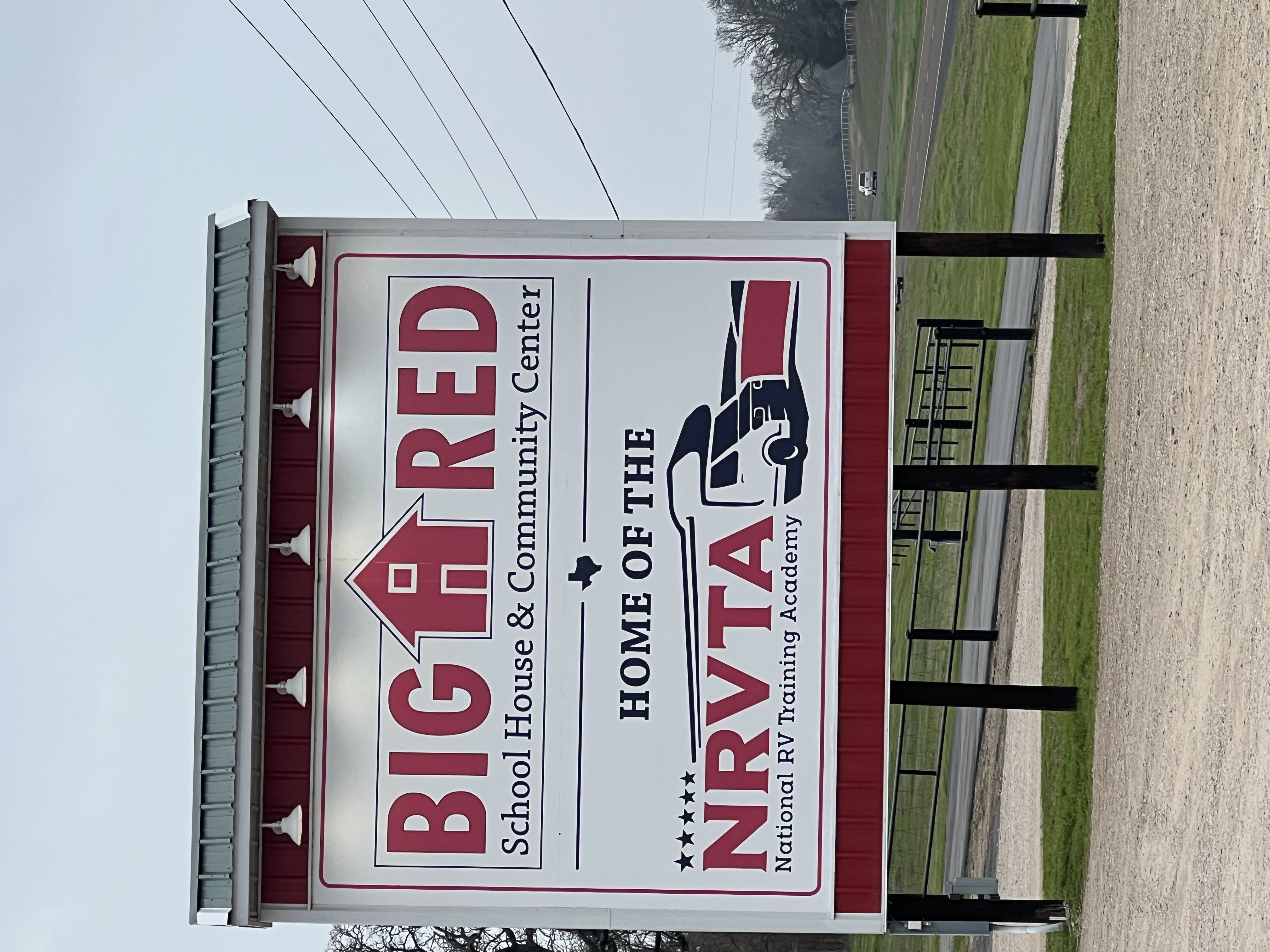 Sign for the Big Red School House and Community Center — Home of the NRVTA National RV Training Academy in Athens, Texas